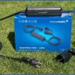 Das Homematic IP Schalt-Mess-Kabel: Die smarte Erweiterung für deinen Garten! Homematic IP Logo auf dem Schalt-Mess-Kabel